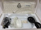 a white box with a keyboard and mouse inside of it