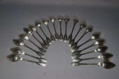 a lot of spoons arranged in a circle on a table