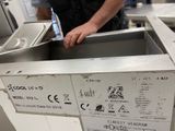 a man that is standing in front of a dishwasher