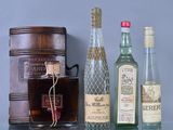several bottles of alcohol are lined up on a glass table