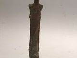 a small statue of a man with a hat on his head
