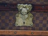 a close up of a suitcase with a lock on it