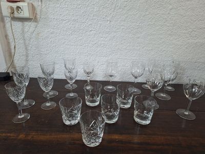 a lot of wine glasses sitting on a table