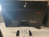 a computer monitor sitting on a desk with a price tag attached to it