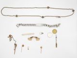 an assortment of jewelry including a necklace, bracelet, and other items