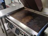 a large oven that is sitting in the middle of a kitchen