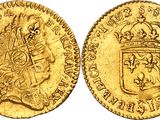 a gold coin with a crown on top of it