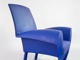 an image of a blue chair sitting on top of a white floor