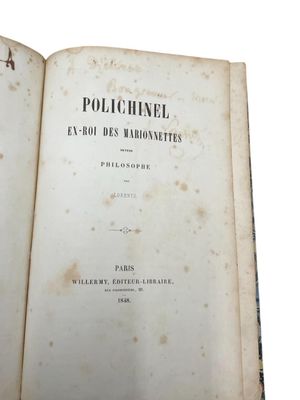 a book open on a table with a white background