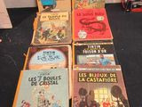 several children ' s books are lined up on a black table