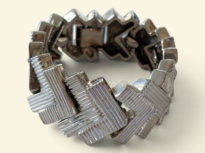 a close up of a bracelet made out of metal