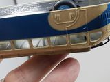 a hand holding a toy bus that is in the palm of someone ' s hand