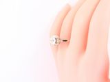 an image of a woman ' s hand with a diamond ring on it