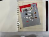 an open book with a picture on it sitting on a bed