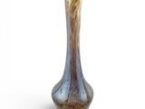 a glass vase that is sitting on a white surface