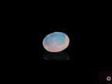 a white oplite in the dark with a black background