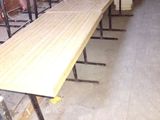 a long wooden table in the middle of a room