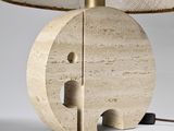 an elephant lamp with a woven shade on top of it