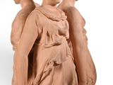 statue of an angel holding a bird on a white background