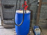 an image of a blue barrel with a pump attached to it