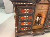 a small cabinet that has a fireplace inside of it