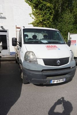 a white van that is parked in a parking lot