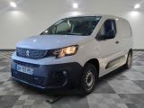 the white van is parked in a large room with a checkered floor