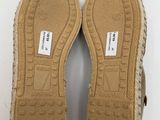 the soles of a pair of slippers are shown on a white surface