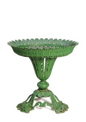 a green vase that is on a stand on a white background
