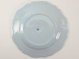 a blue plate with a blue dot on it