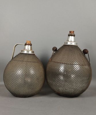 pair of antique pewed metal jugs with handles and handles