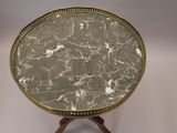 an image of a marble topped table with wooden legs