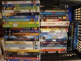 a lot of dvd ' s stacked on top of each other