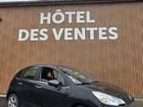 a black car parked in front of a building