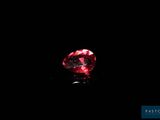 a red diamond on a black background