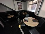 a table and chairs in the corner of a restaurant