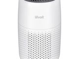 a close up of a white air purifier on a white background