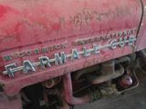 a close up of a red tractor with the word farmall on it