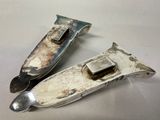 two knives that are sitting next to each other on a table