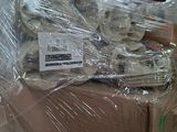a pile of boxes with a bunch of forks wrapped in plastic