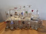 a lot of glasses sitting on a wooden table
