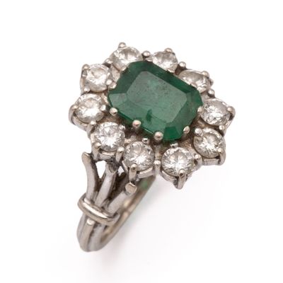 an emerald and diamond clusterer ring