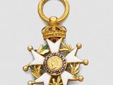 an image of a gold medal with a star on it