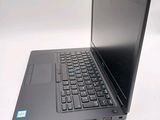 a laptop that is sitting on a white table