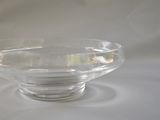 a clear glass bowl with a small amount of water in it