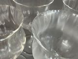 many empty wine glasses sitting on a tray
