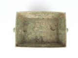 a small metal object that is on a white surface
