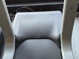 a seat on a bus that is empty of passengers