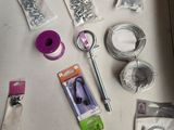 a table that has various items on it including scissors, scissors, and other items