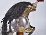 a helmet with a long black hair attached to it